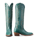 Pair of teal cowboy boots with decorative patterns on a white background
