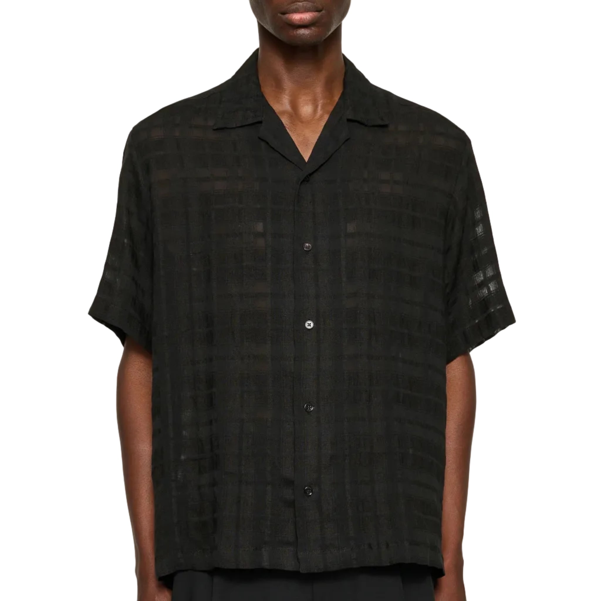 Man wearing a black checkered shirt against a white background