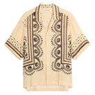 Beige shirt with black print on a light white background