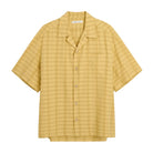 Yellow checkered shirt on a white background