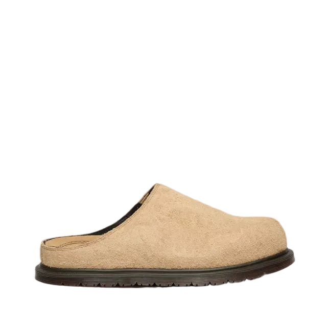 Tan mules on a white background