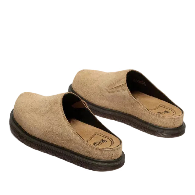 Tan mules on a white background
