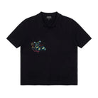 Black polo shirt with colorful graphic on a white background