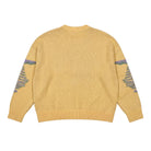 Yellow sweater with patterned sleeves on a white background