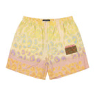 Yellow and pink patterned shorts with a brand logo on a white background