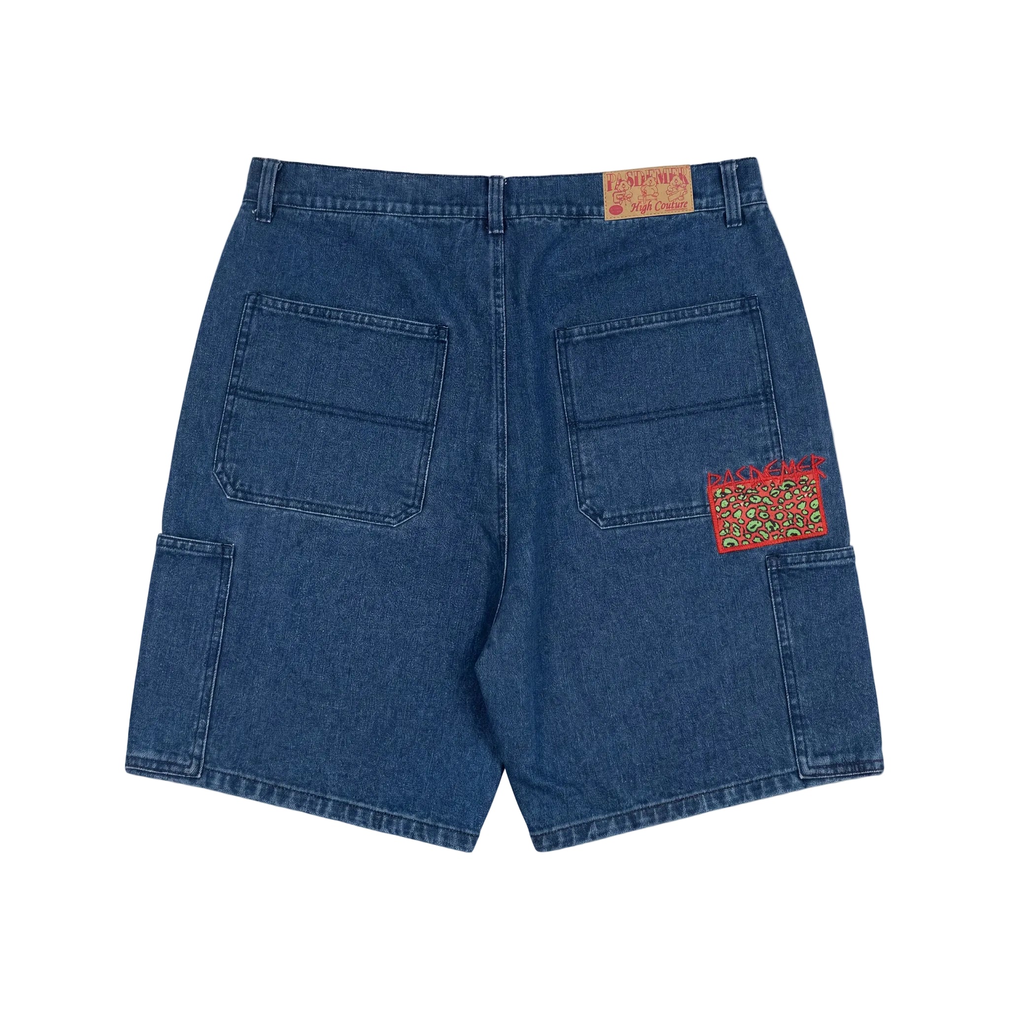 Blue denim shorts with a patch on the back pocket on a white background
