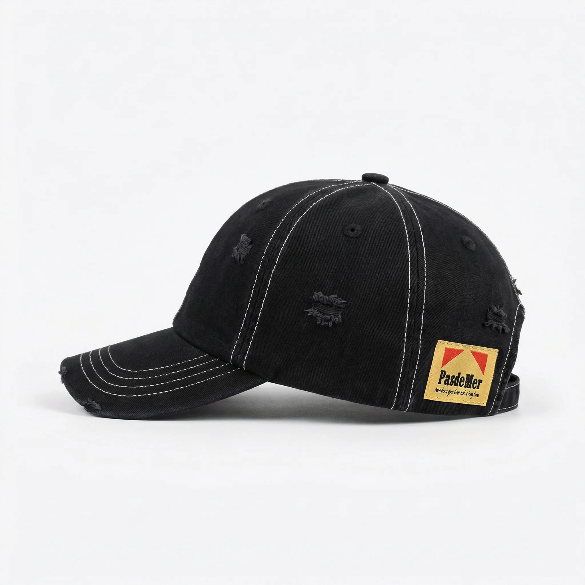 Black baseball cap with a yellow label on a white background