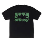 Black t-shirt with green 'stussy' logo on a white background