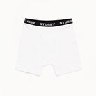 White boxer briefs with black Stussy waistband on a white background