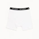White boxer briefs with a black Stussy waistband on a white background