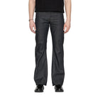 Person wearing dark blue jeans on a white background