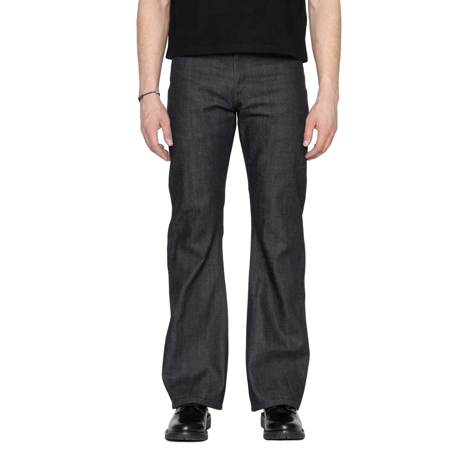 Person wearing dark blue jeans on a white background