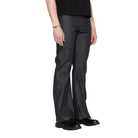 Person wearing dark blue jeans on a white background