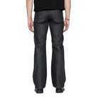 Person wearing dark blue jeans on a white background