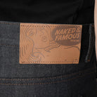 Branded leather patch on a dark blue jean