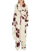 Woman wearing a floral kimono with a white background