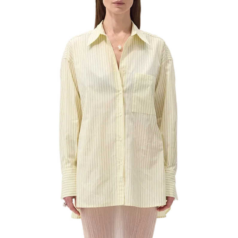 Model in a yellow shirt with pinstripes on a white background