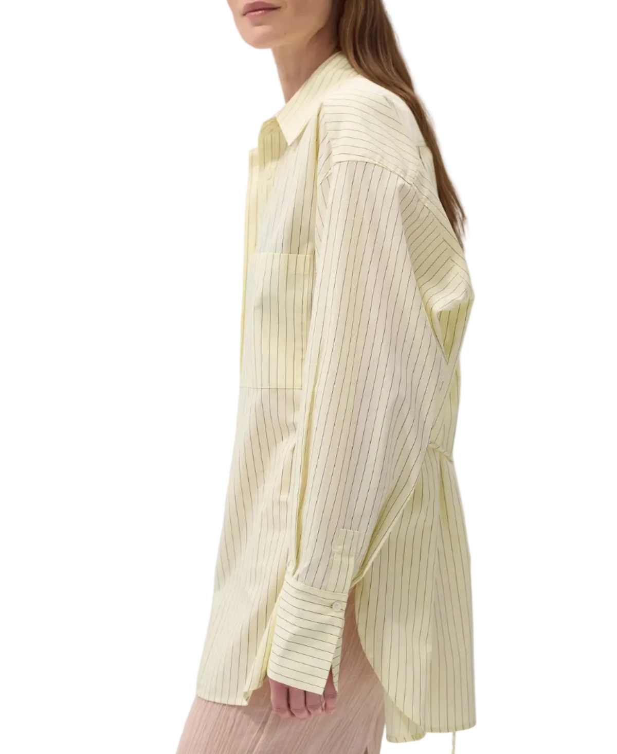 Woman wearing a light yellow striped shirt and sunglasses on a white background