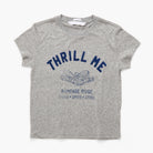 A heather gray short-sleeve t-shirt with a navy blue graphic print on the front reading 'THRILL ME' and 'RAMPAGE RIDGE CHAOS + SPEED + STEEL'.