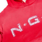 Red hoodie with white floral embroidery on a white background