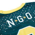 Teal sports jersey with yellow accents and 'N GO' branding.