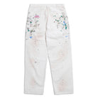 White pants with paint splatter details on a white background