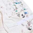 White garment with colorful paint splashes on a white background