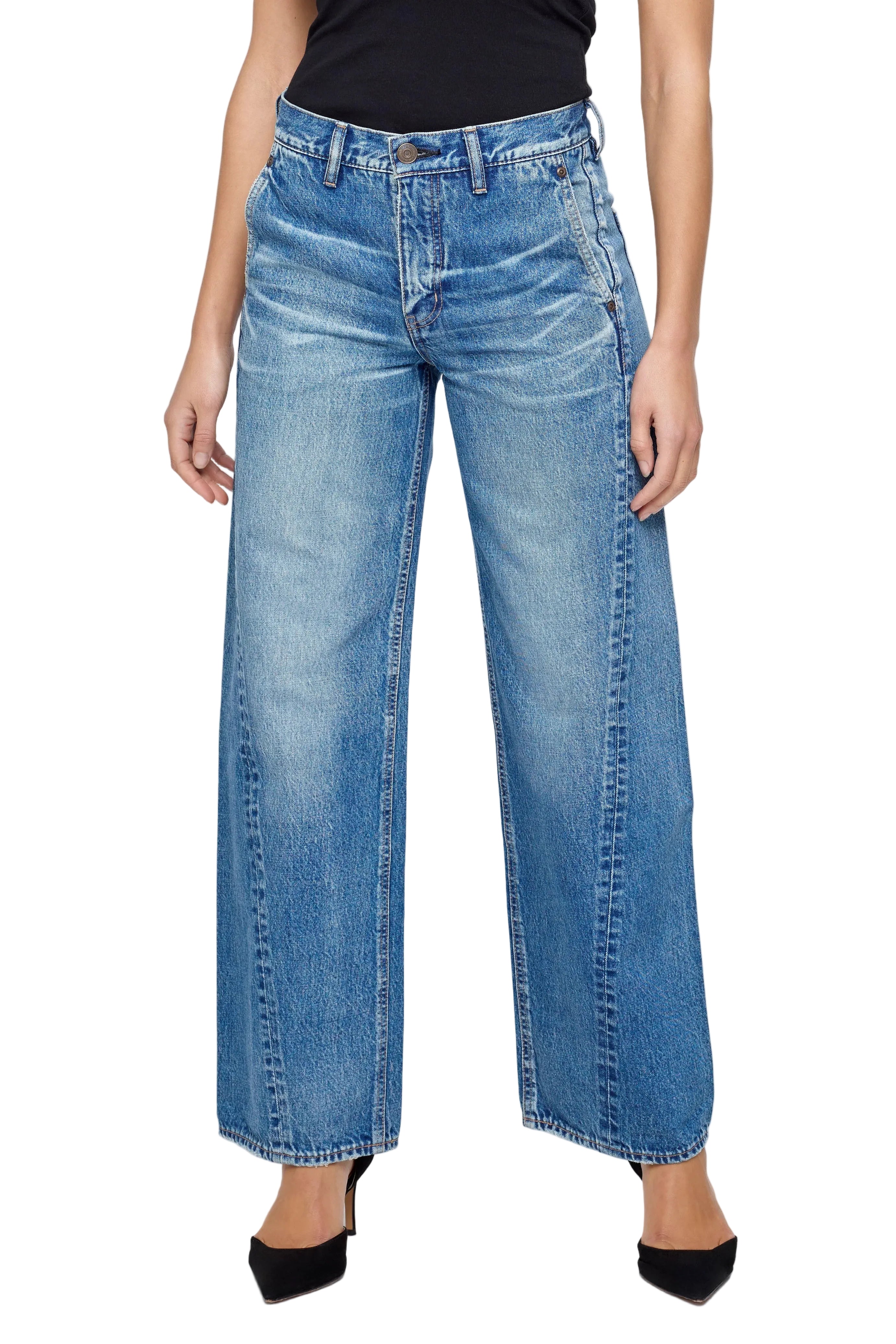 Person wearing blue jeans on a white background