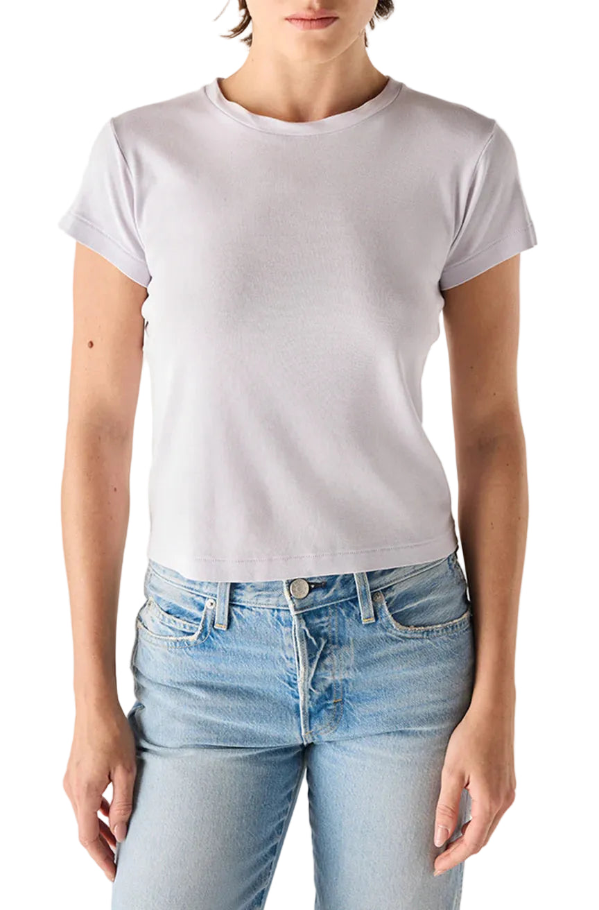 Person wearing a light purple t-shirt and light blue jeans on a white background