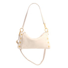 White leather convertible bag with gold accents on a white background