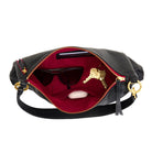 Interior view of a black leather convertible bag with red and gold accents on a white background