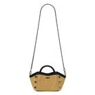 Tan textured convertible mini bag with black accents on a white background