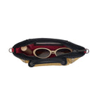 Interior view of a tan textured convertible mini bag with black accents on a white background
