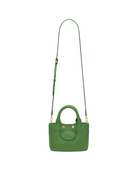 Green mini convertible tote bag with gold accents on a white background
