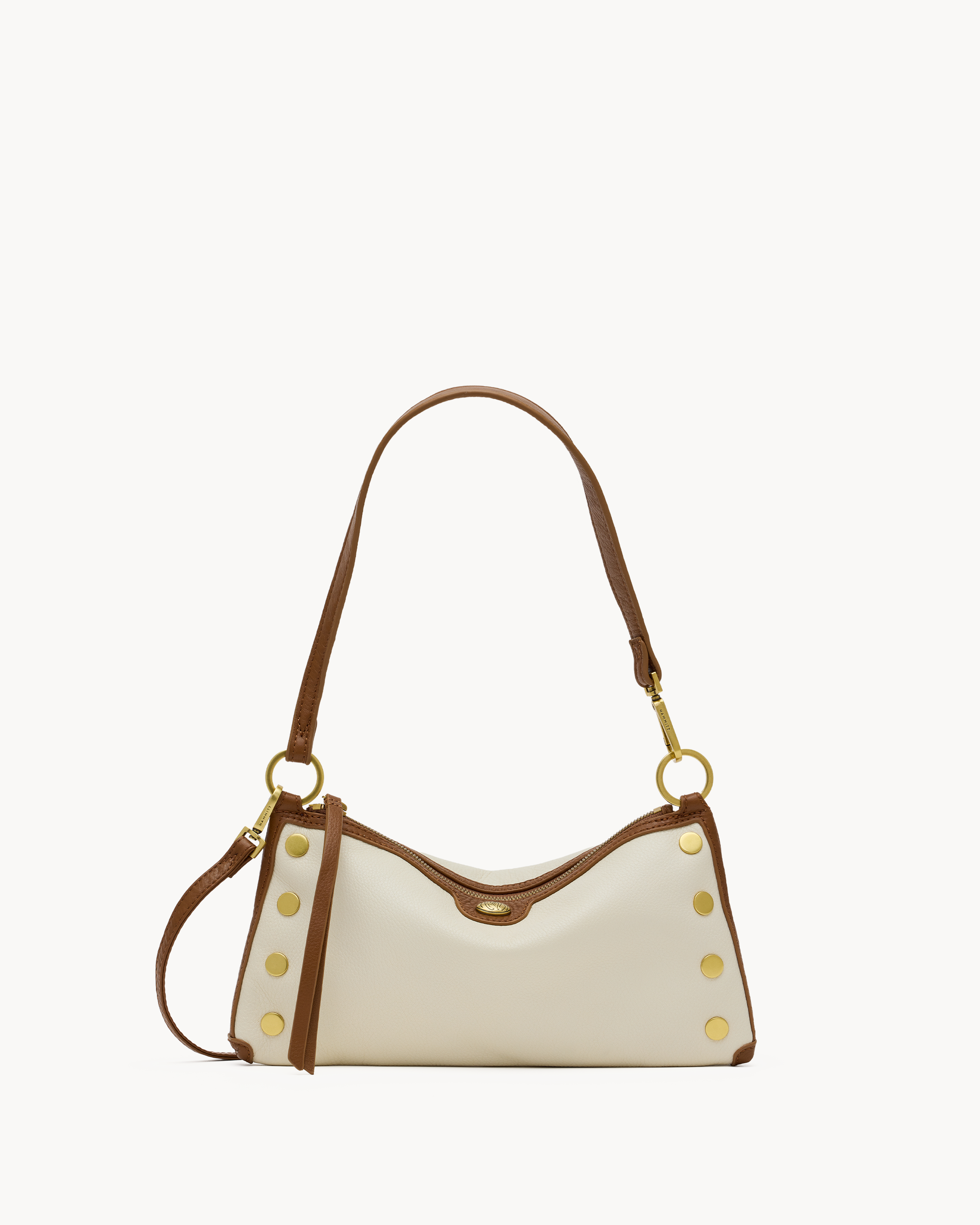 Cream convertible handbag with brown & gold accents on a white background 