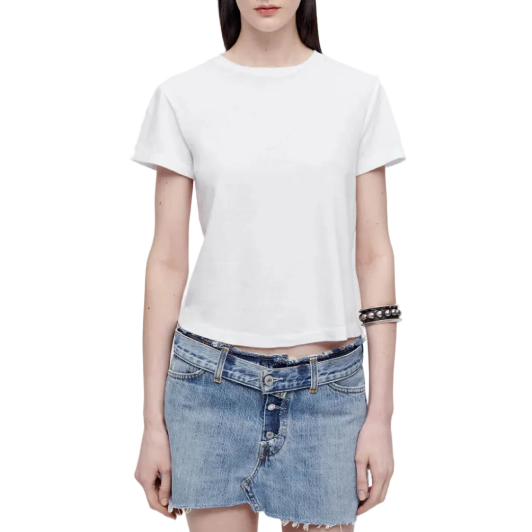 Model in a white t-shirt and denim skirt on a white background