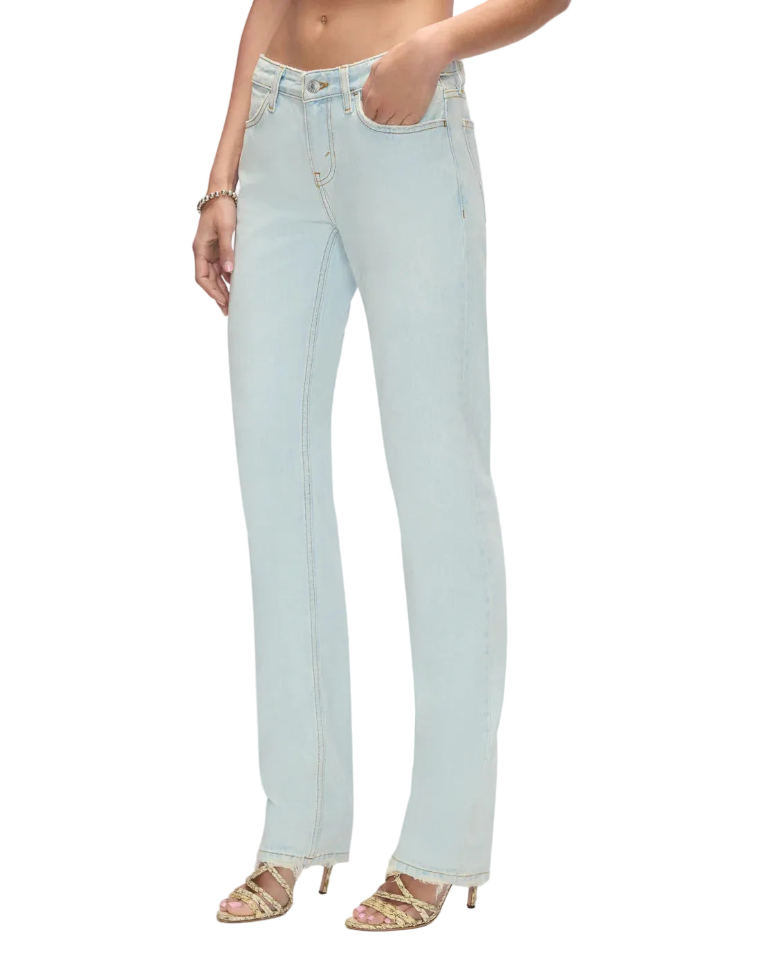 Model in light blue jeans on a white background
