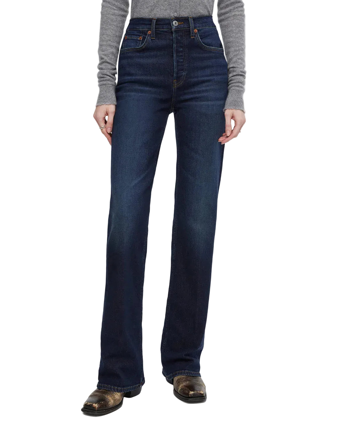 Model in blue jeans on a white background