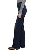 Model in blue jeans on a white background