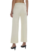 Model in white wide-leg jeans on a white background