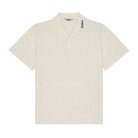 Beige short-sleeve shirt with a brand logo on a white background