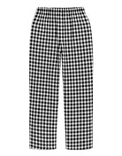 Black and white gingham checkered pants on a white background