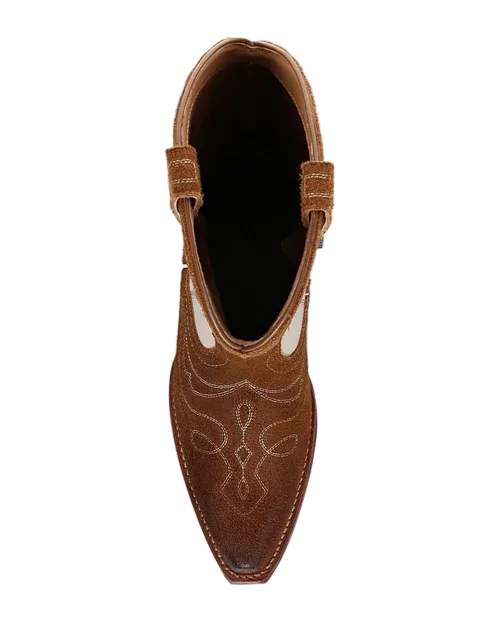 Brown and cream cowboy boots on a white background top view