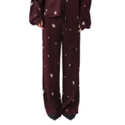 Maroon outfit with white floral patterns on a white background
