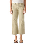 Person wearing a white top and striped pants on a white background