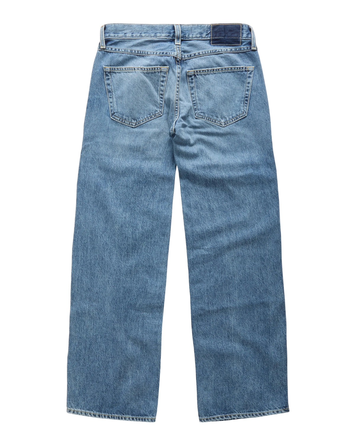 Light blue denim jeans shown from the back, featuring a classic five-pocket design and a dark blue brand patch on the back waistband, photographed against a clean white background.