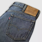 Close-up of Levi's jeans with brand label on a light gray background