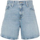 Light blue denim shorts on a white background