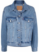 Blue denim jacket on a white background