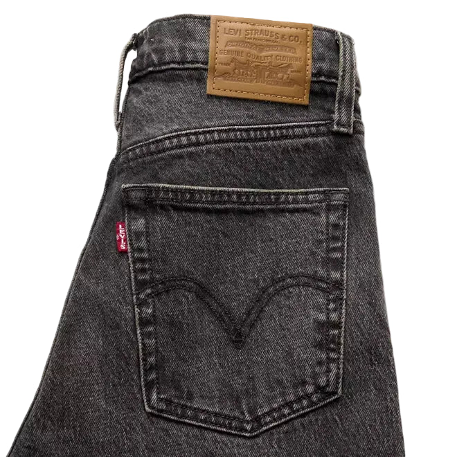 Black Levi's jeans with a brand label on a white background